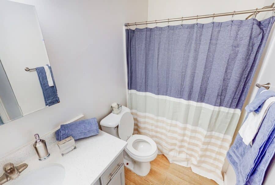 Student apartment bathroom with vanity & shower